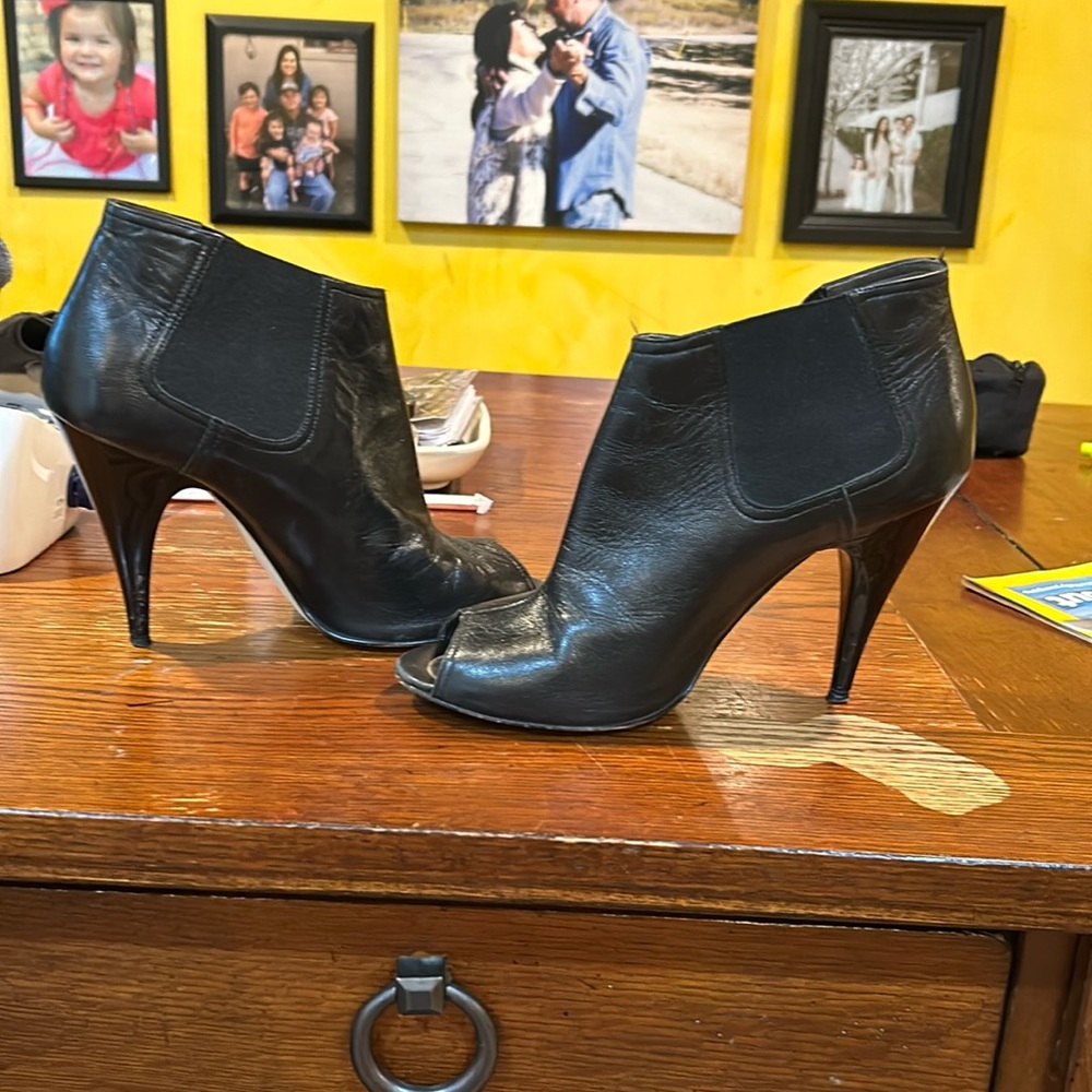 Black heels. Worn. 2 inch   Stretch at ankle